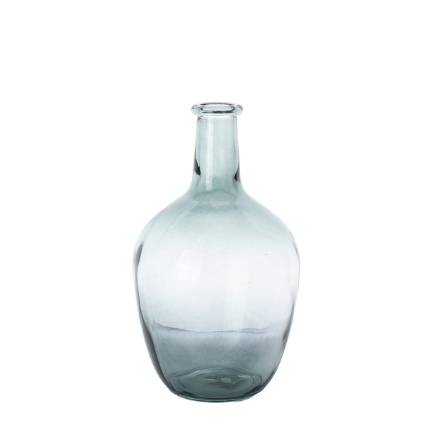 large transparent glass vase in the shape of a bottle