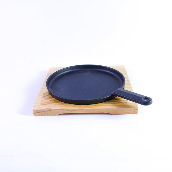 A frying pan on a wooden stand, size 20 cm